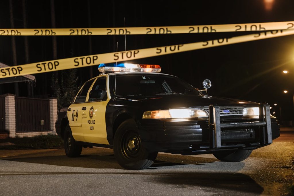 a Ford police car at the crime scene