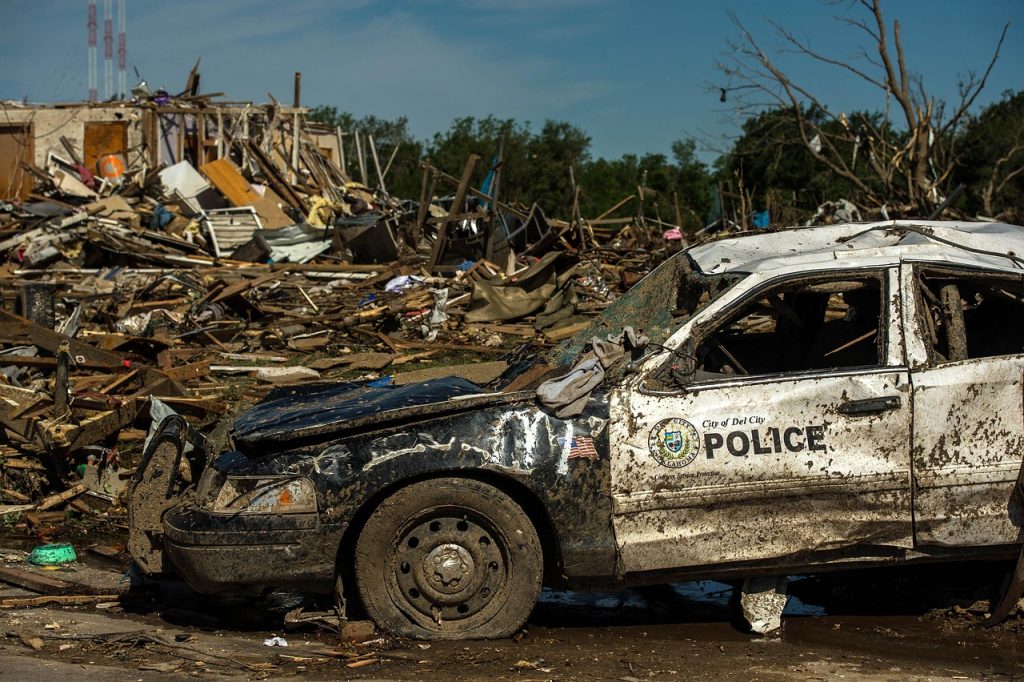 a retired police car damaged in a storm