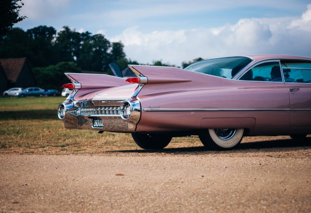 a classic pink convertible that had many owners