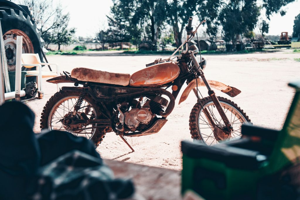 salvage motorcycle near a repair shop