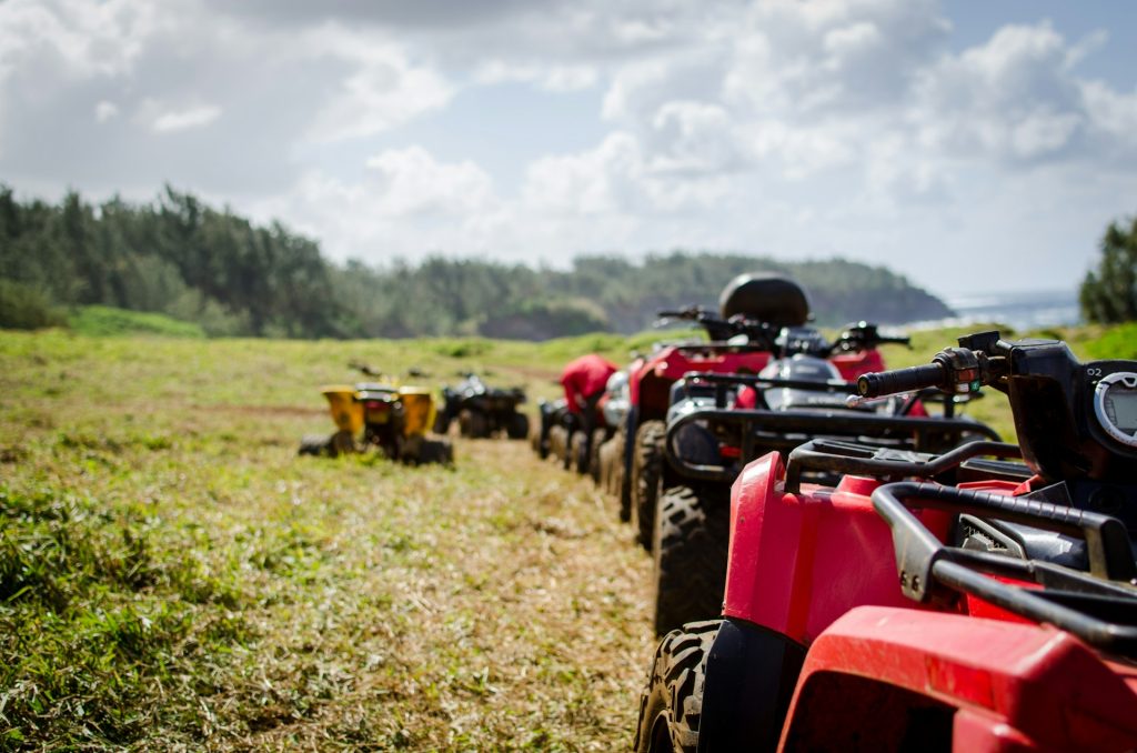 many ATVs and UTVs near the forest