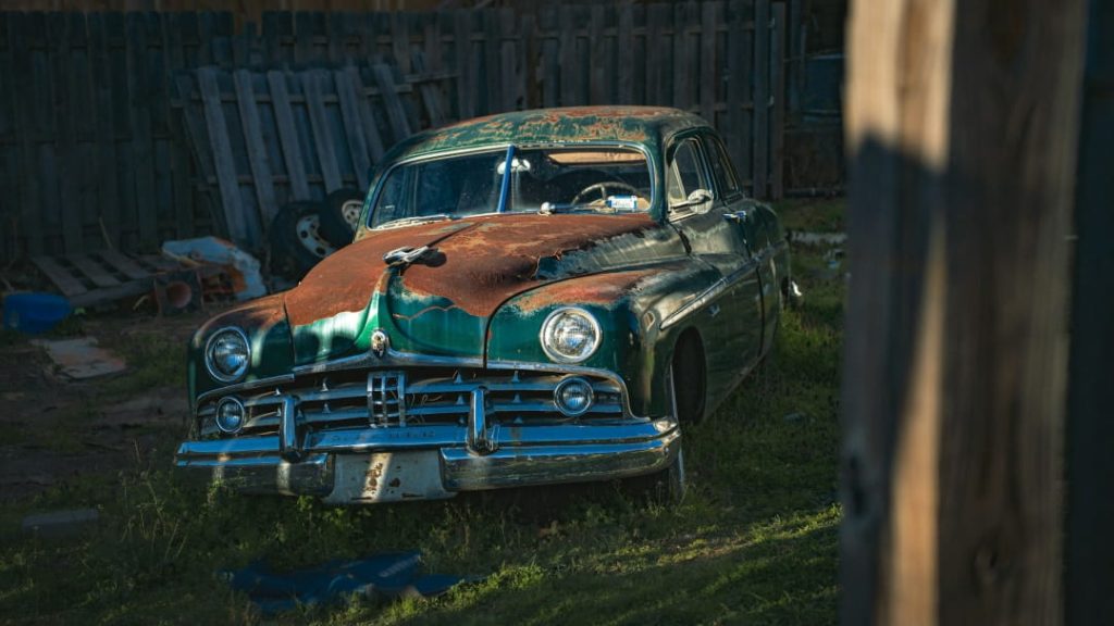 heavily rusted old vehicle showing typical salvage damage